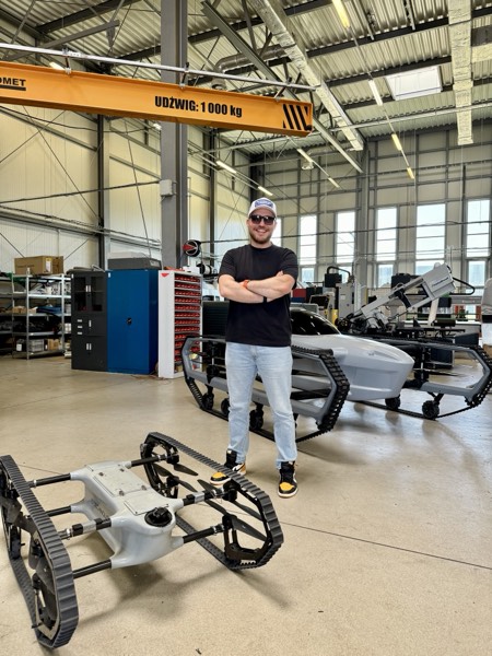 Vadym Melnyk on the factory floor with autonomous robots
